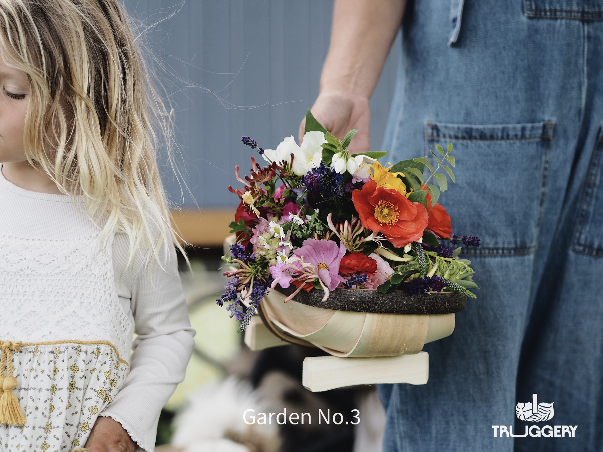 Garden No.3 Sussex Trug filled with flowers with little girl in rustic countryside setting